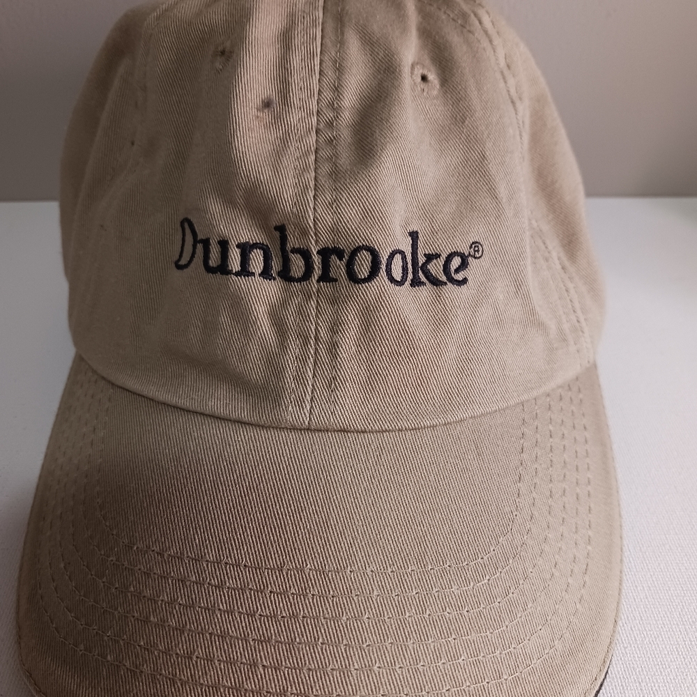 Women's Legend dunbrook baseball cap, color tan, dumb broke on front of cap,
